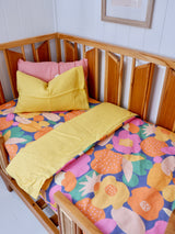 Bright floral linen with yellow linen cot quilt