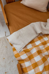 Mustard gingham 100% linen cot sheet