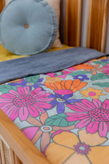 Brittany floral with washed denim blue linen cot quilt