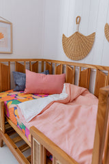 Peachy pink linen with white linen cot quilt