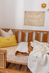 Stonewashed mustard linen with white linen cot quilt