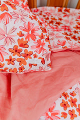 Pink and orange floral with salmon linen cot quilt