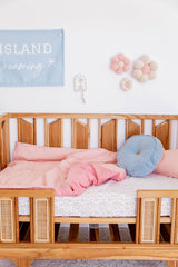 Peachy pink linen with blossom linen cot quilt