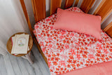 Pink and orange floral fitted cot sheet