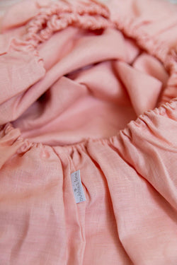 Peachy pink 100% linen cot sheet