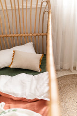 Stonewashed terracotta with white linen cot quilt