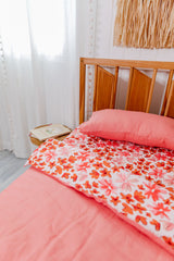 Pink and orange floral with salmon linen cot quilt