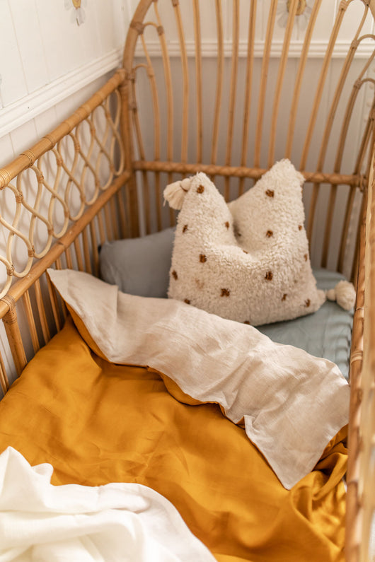 Stonewash mustard linen with bone linen cot quilt Bubbles Lane