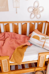 Stonewashed terracotta with stonewashed mustard linen cot quilt