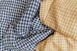 Yellow gingham linen with white linen cot quilt