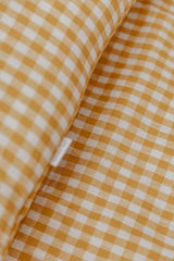 Yellow gingham linen with white linen cot quilt