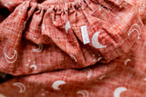 Rust moons fitted cot sheet