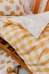 Yellow bold gingham linen with white linen cot quilt