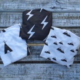 White with black teepee change sheet, charcoal lightning bolt change sheet 